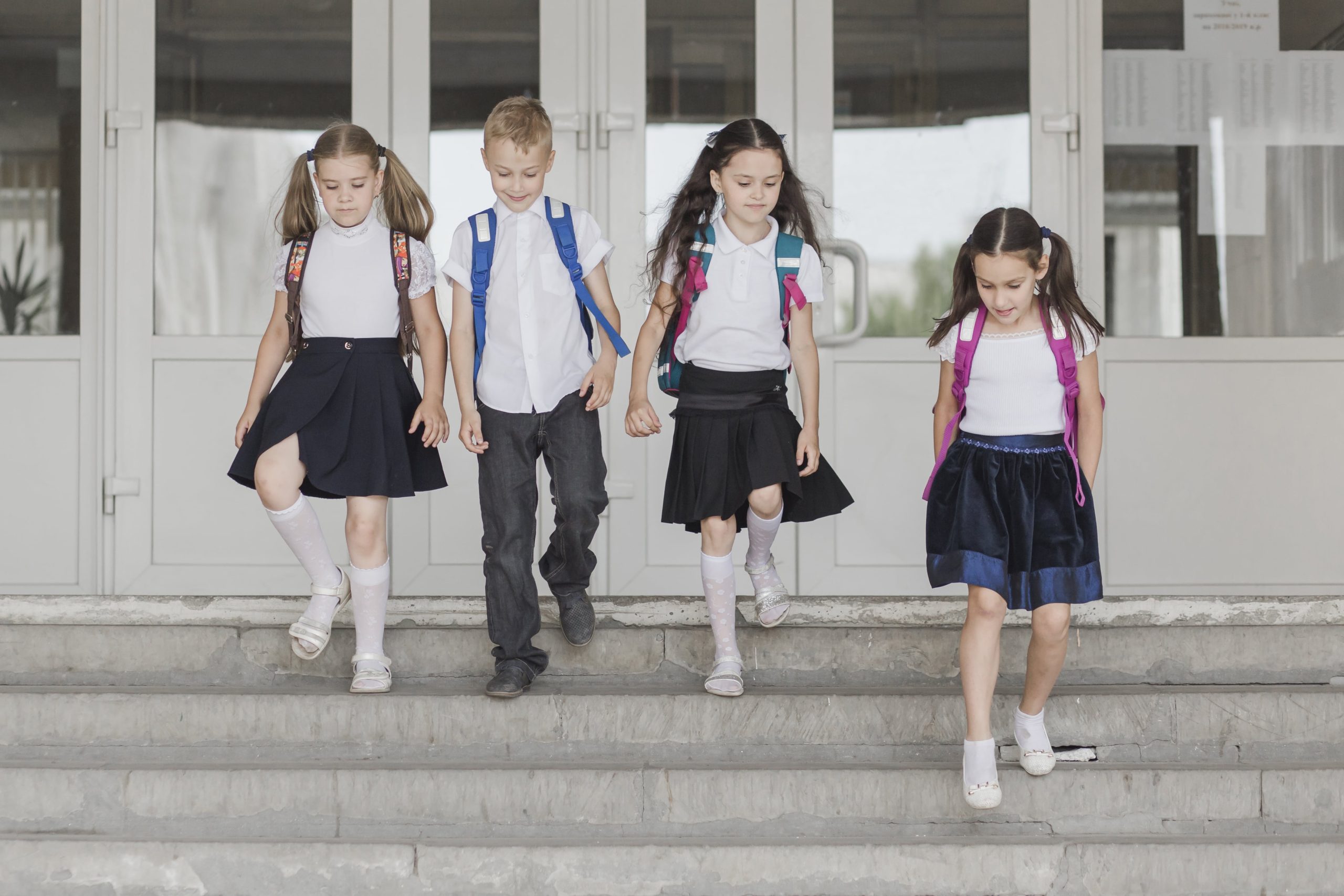 kids-walking-down-school-steps-min